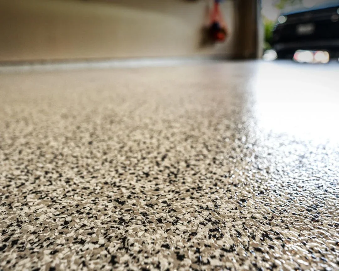 Close-up of a flake epoxy garage floor coating — USA Concrete Co.